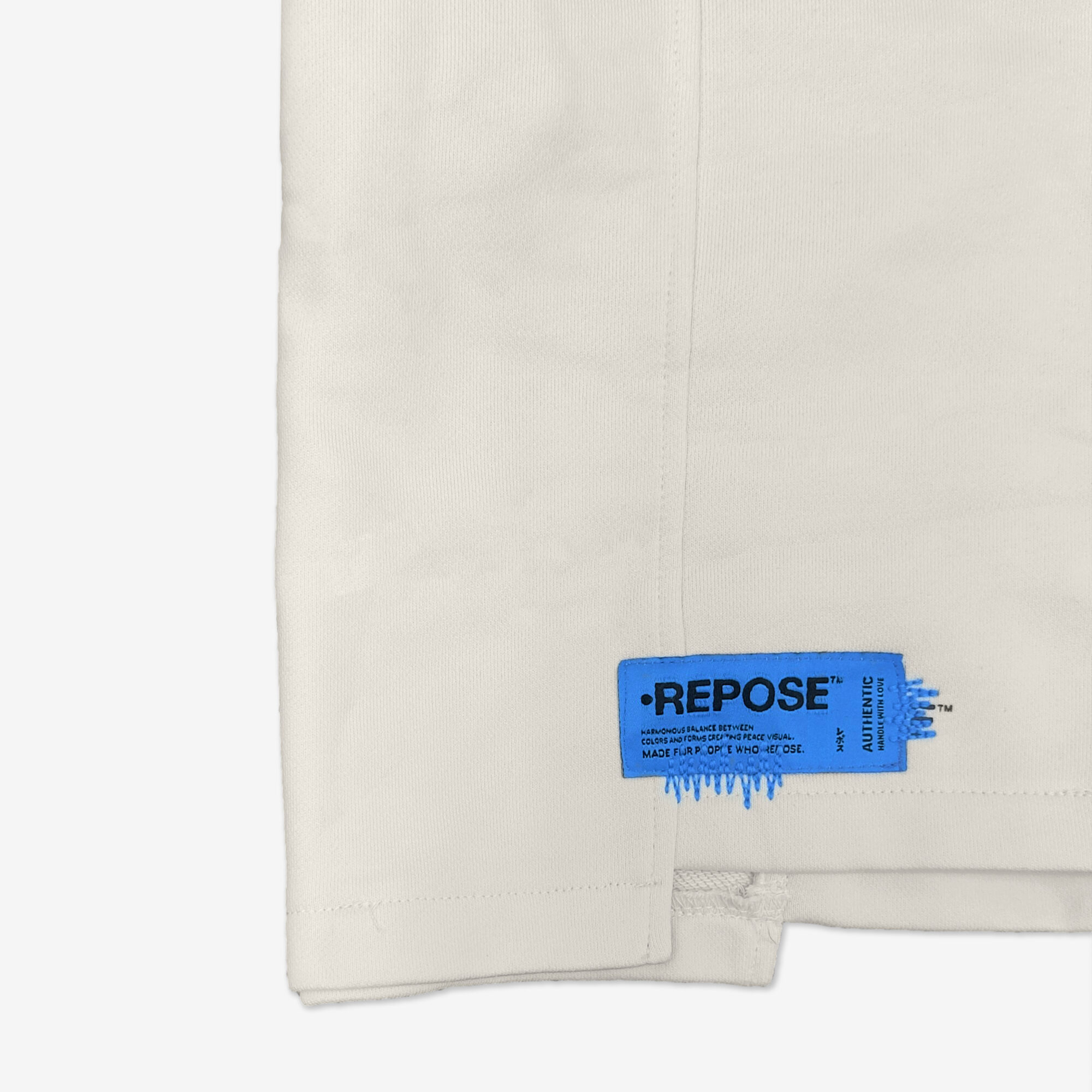 REPOSE Uneven Cut Cream Shorts